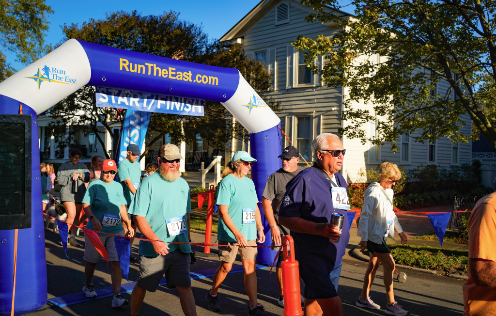 Runners passing under the Nut Run arch at the Edenton Peanut Festival