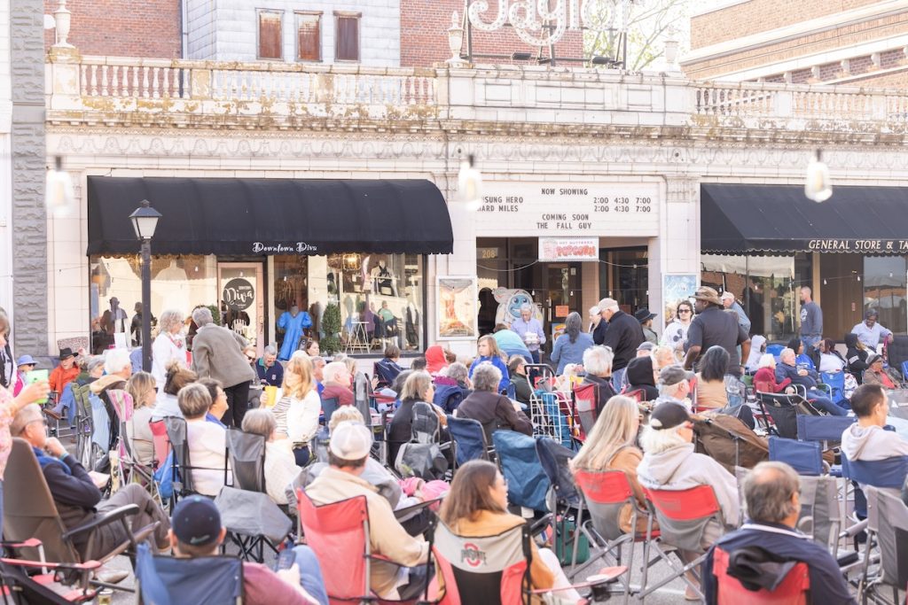 Audience seated on Broad Street for live music at Boogie on Broad
