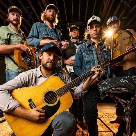 Band posing with guitars and banjo for the Albemarle RockFish Fest